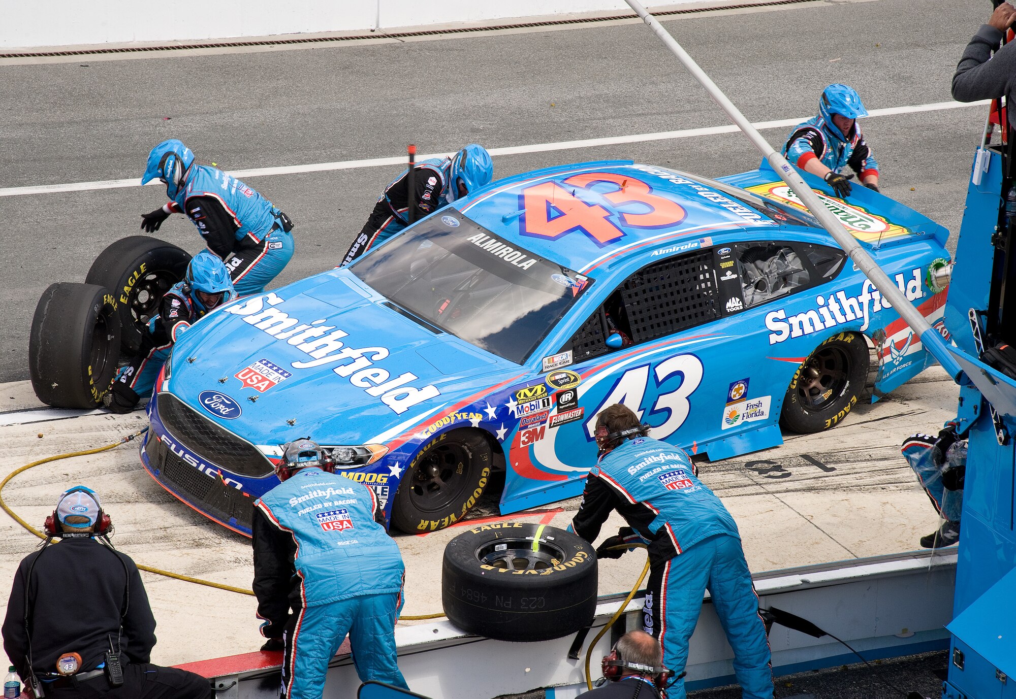 Aric Almirola, NASCAR Sprint Cup Series driver for the No. 43 Smithfield Ford, comes in for a pit stop during the AAA 400 Drive for Autism NASCAR Sprint Cup Series race May 15, 2016, at Dover International Speedway, Dover, Del. The U.S. Air Force, one of many sponsors of the No. 43 car, finished in 31st place as a result of an 18-car wreck during a restart. (U.S. Air Force photo/Roland Balik)