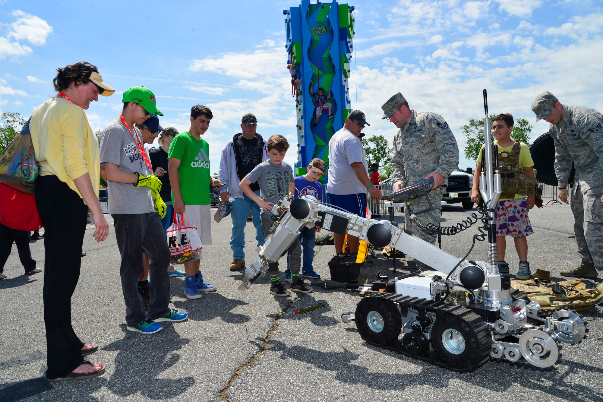 Staff Sgt. Jason Evans, 436th Civil Engineer Squadron Explosive Ordnance Disposal technician, operates a robot for NASCAR fans May 14, 2016, at Dover International Speedway in Dover, Del. The EOD flight let fans try on battle-rattle equipment and sit inside of a M1165 Humvee that was set up inside of the Monster Mile Youth Nation. (U.S. Air Force photo/Senior Airman William Johnson)
