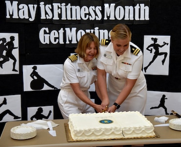 Capt. Elizabeth French, Senior Nurse Executive at Naval Health Clinic
Charleston (left), and Lt. Samantha Favreau, a nurse and the NHCC Military Home
Port Blue Team Leader, cut the cake during a ceremony May 13 at NHCC to
celebrate the 108th birthday of the Navy Nurse Corps. (Navy photo/ Petty
Officer 3rd Class Robert Jackson)
