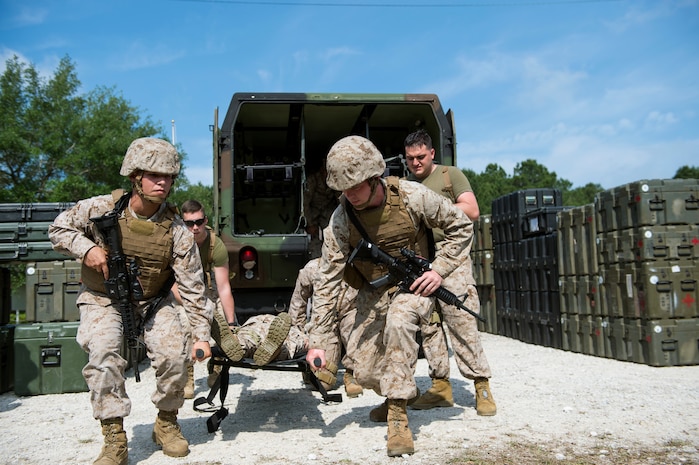 Sailors and Marines assigned to Surgical Company B, 4th Medical Battalion, transport a patient during a five-day medical field exercise May 13, 2016 at Joint Base Charleston, S.C. The exercise tested the capabilities of Surgical Company B’s forward resuscitative surgical system, or FRSS, which is a rapidly mobile trauma surgical team designed to be in close proximity to combat units on the battlefield. (U.S. Air Force photo/Staff Sgt. Jared Trimarchi) 