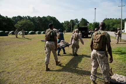Sailors assigned to Surgical Company B, 4th Medical Battalion, transport a simulated patient during a five-day medical field exercise May 13, 2016 at Joint Base Charleston, S.C. The exercise tested the capabilities of Surgical Company B’s forward resuscitative surgical system, or FRSS, which is a rapidly mobile trauma surgical team designed to be in close proximity to combat units on the battlefield. (U.S. Air Force photo/Staff Sgt. Jared Trimarchi) 