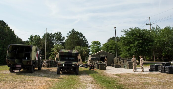 Sailors assigned to Surgical Company B, 4th Medical Battalion, prepare equipment during a five-day medical field exercise May 13, 2016 at Joint Base Charleston, S.C. The exercise tested the capabilities of Surgical Company B’s forward resuscitative surgical system, or FRSS, which is a rapidly mobile trauma surgical team designed to be in close proximity to combat units on the battlefield. (U.S. Air Force photo/Staff Sgt. Jared Trimarchi) 
