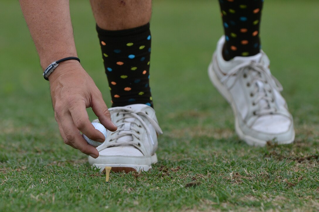 A Commander’s Cup Golf Tournament participant tees his golf ball at Fort Eustis, Va., May 13, 2016.  Teams played 18 holes on the Pines Golf Course, which is open year round and is approximately 6,977 yards. (U.S. Air Force photo by Staff Sgt. Natasha Stannard)
