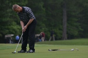 U.S. Air Force Chief Master Sgt. Mark Hurst, command chief of the 633rd Air Base Wing, putts during the Commander’s Cup Golf Tournament at Fort Eustis, Va., May 13, 2016. The tournament course rotates between Langley Air Force Base and Fort Eustis annually to promote a joint community. (U.S. Air Force photo by Staff Sgt. Natasha Stannard)