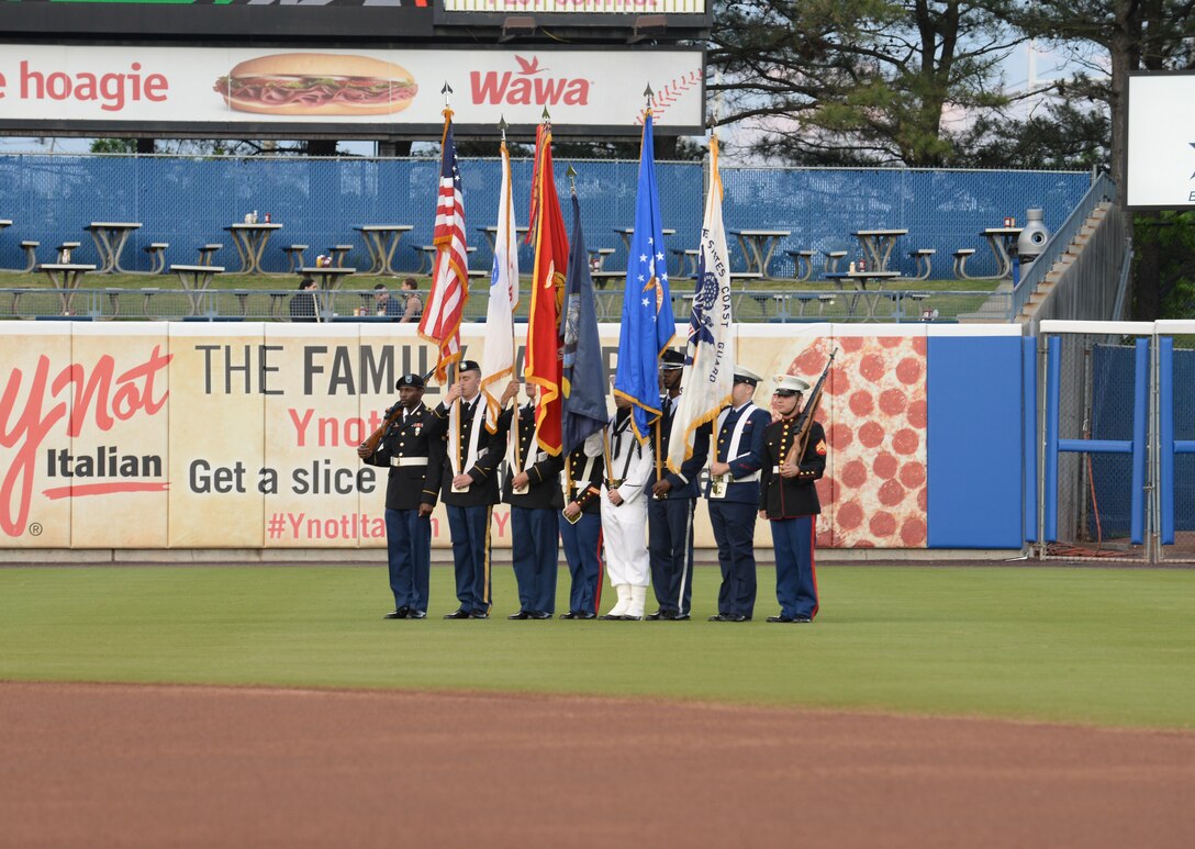 The U.S. Joint Service Color Guard presents the colors during the opening ceremony of the Norfolk Tides Armed Forces Night baseball game in Norfolk, Va., May 14, 2016. Events included performances of U.S. military anthems, as well as first pitches thrown by U.S. Service members from each branch of the Armed Forces. (U.S. Air Force photo by Staff Sgt. John D. Strong III)