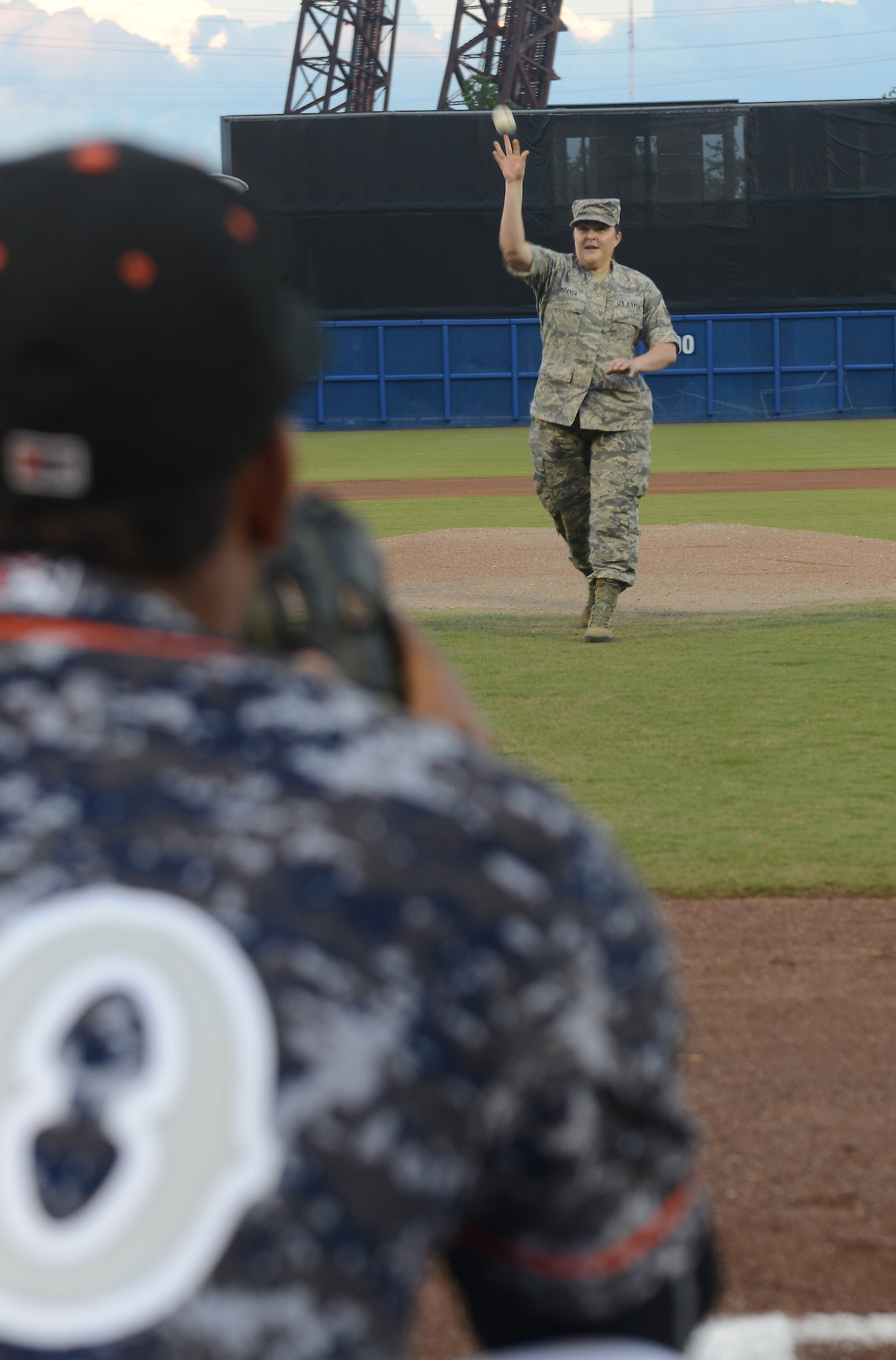 U.S. Air Force Senior Airman Rosemary Miranda, secretary of Langley’s Airmen Committed to Excellence, throws out the first pitch at the Norfolk Tides Armed Forces Night baseball game in Norfolk, Va., May 14, 2016. The Tides wore digital camouflage print uniforms during the game against the Buffalo Bisons to honor Service members from all branches of the Armed Forces. (U.S. Air Force photo by Staff Sgt. Teresa J. Cleveland)