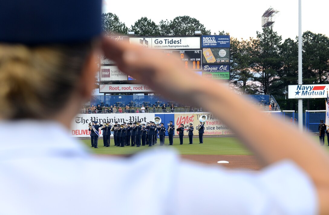 U.S. Air Force Col. Caroline M. Miller, 633rd Air Base Wing commander, renders a salute as the Heritage of America Band plays the Star-Spangled Banner at the Norfolk Tides Armed Forces Night baseball game in Norfolk, Va., May 14, 2016. The event honored Service members from all branches of the Armed Forces within the local community. (U.S. Air Force photo by Staff Sgt. Teresa J. Cleveland)