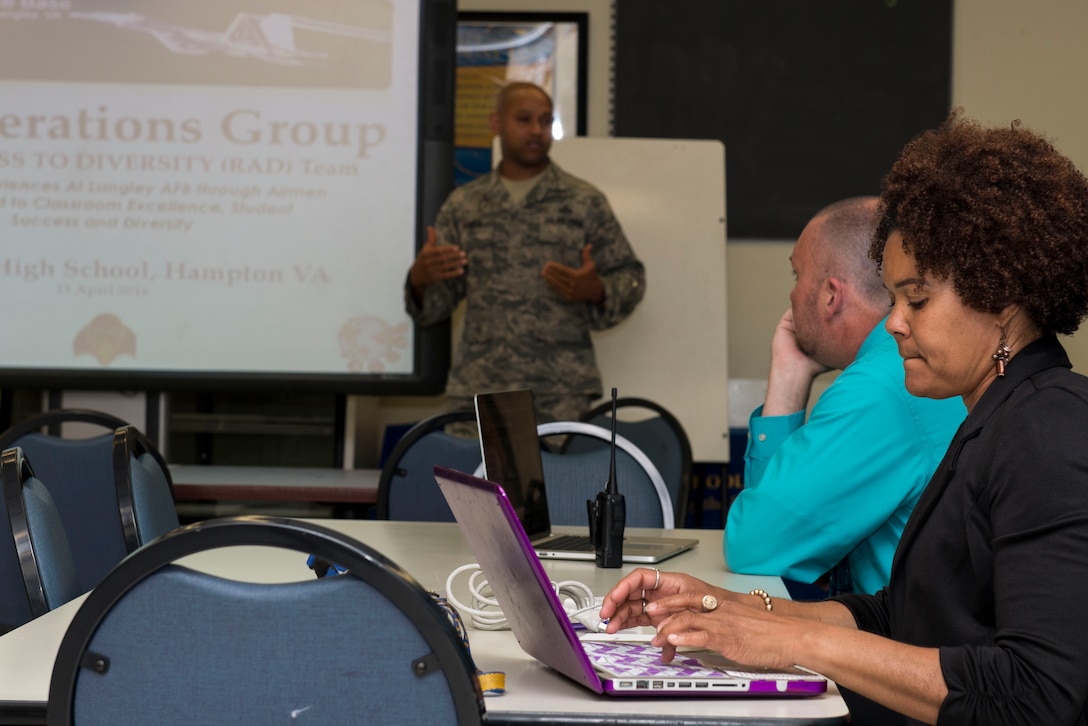 Teachers listen and take notes as U.S. Air Force Senior Master Sgt. Terrell Rogers, co-founder and chair for Real Access to Diversity team, presents the program at Phoebus High School, Va., April 13, 2016. The RAD team visits local high schools to interact, mentor and bring relevance to the student’s course work by using their experience in the Air Force. (U.S. Air Force photo by Airman 1st Class Derek Seifert)