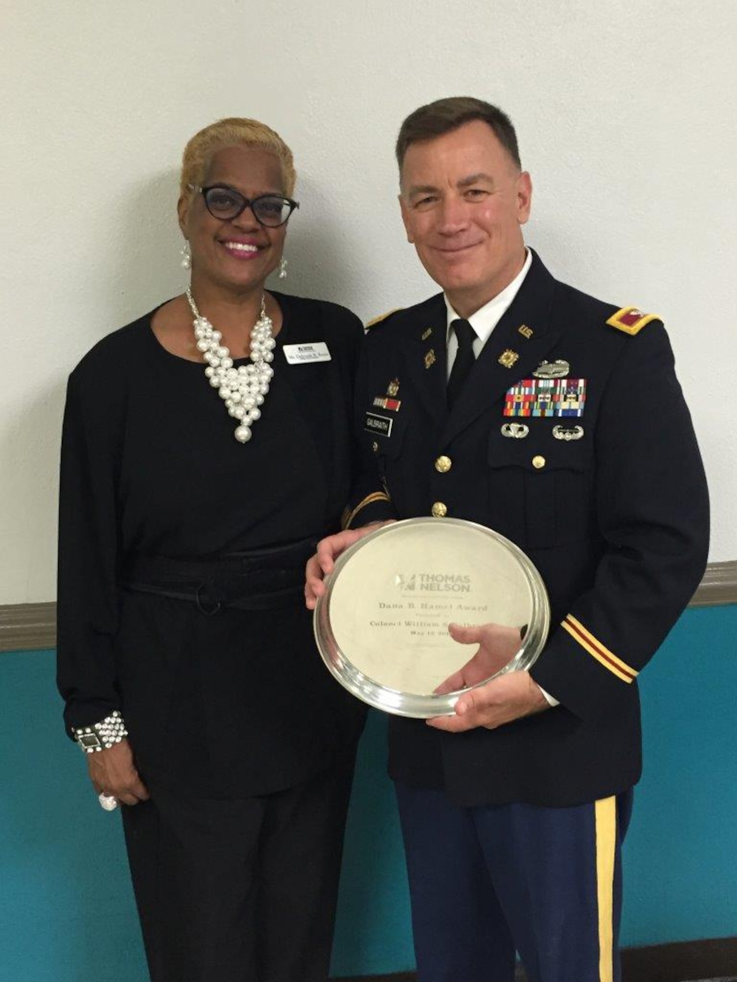 U.S. Army Col. William S. Galbraith, commander of the 733rd Mission Support Group, receives the Dana B. Hamel Award from Thomas Nelson Community College during their 47th annual commencement ceremony at the Hampton Coliseum in Hampton, Va., May 12, 2016. The award honors citizens who champion higher education and public service. Named in honor of Dr. Dana B. Hamel, the first chancellor of Virginia's Community Colleges, the award recognizes individuals for their commitment to public service; to fostering access to higher education and promoting an understanding of the role of workforce development as an essential part of Thomas Nelson's mission. (courtesy photo)
