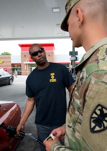 U.S. Army Master Sgt. Ernest Evans, president of the Fort Eustis’ Diamond Council, pumps gas for Pfc. Hunter Janes, 155th Inland Cargo Transfer Company at Fort Eustis, Va., May 10, 2016. The FEDC was formed in early 2015. (U.S. Air Force photo by Staff Sgt. J.D. Strong II)
