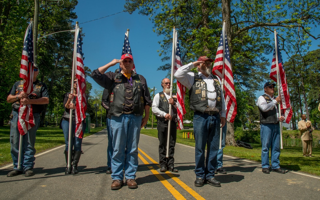 Members of the Patriot Guard salute as the national anthem plays during the Bronze Cross memorial unveiling ceremony in Magnolia Park at Fort Eustis, Va., May 14, 2016. The Patriot Guard riders is a volunteer, federally registered non-profit organization who ensures dignity and respect at memorial services honoring fallen military heroes, first responders and honorably discharged veterans.  (U.S. Air Force photo by Staff Sgt. J.D. Strong II)