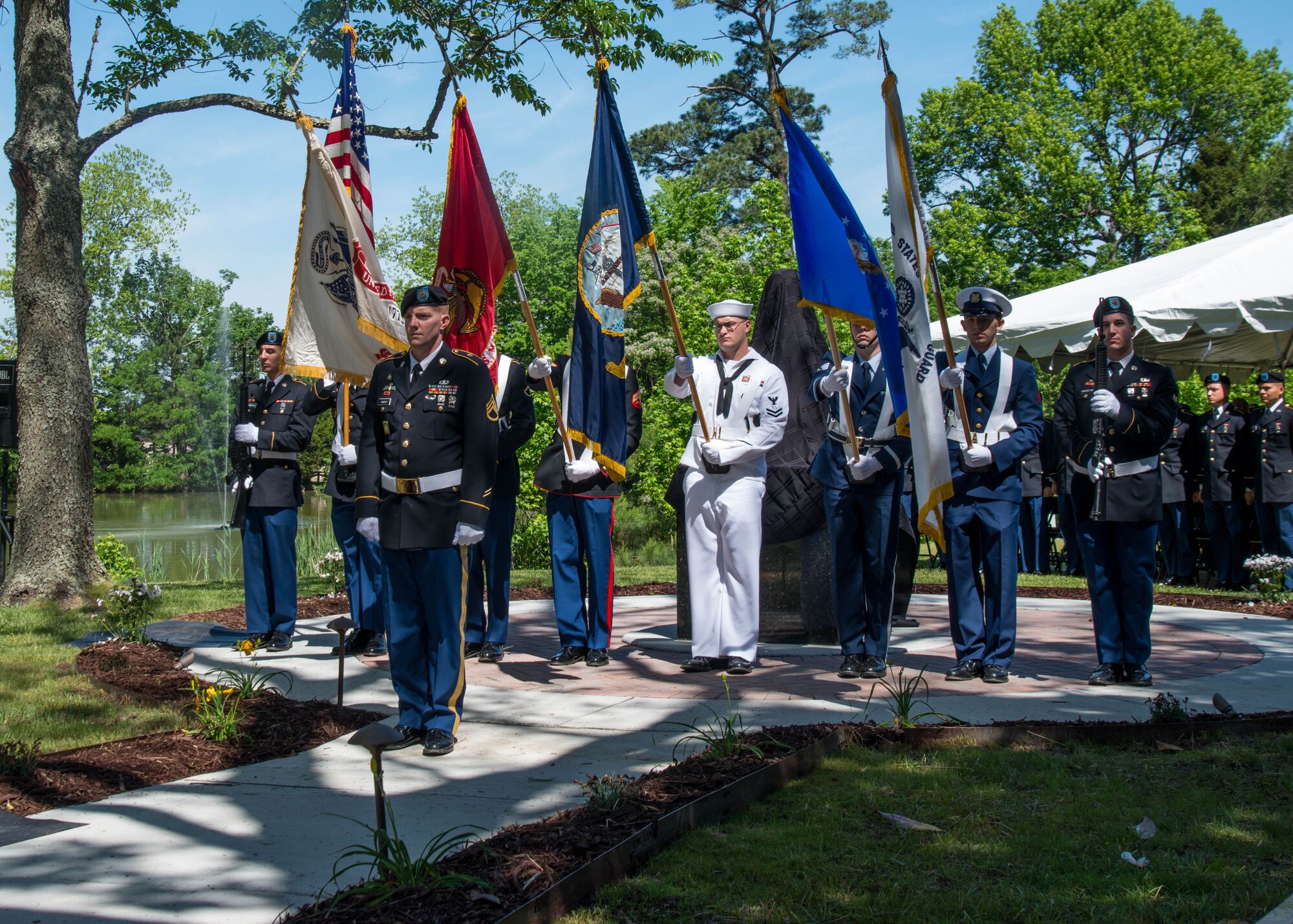 A Joint Service Color Guard members present the colors during the Bronze Cross memorial unveiling ceremony in Magnolia Park at Fort Eustis, Va., May 14, 2016. The color guard is made up of every branch of the U.S. armed forces. (U.S. Air Force photo by Staff Sgt. J.D. Strong II)