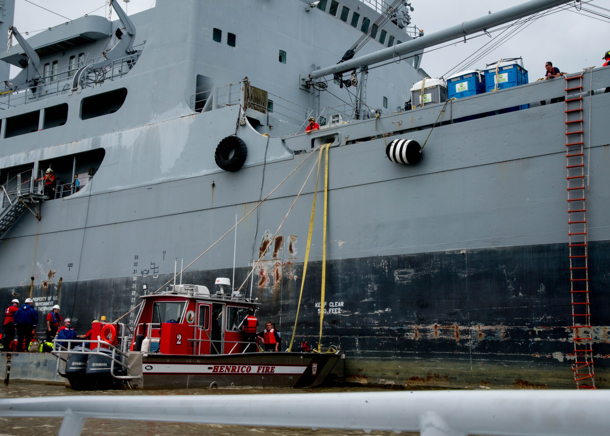 Fire hoses connect to the Cape Avinof during the 25th Annual Hampton Roads Marine Firefighting School maritime incident response exercise at Fort Eustis, Va., May 13, 2016. The exercise was the capstone event for the school, testing all the students learned about responding to a maritime fire incident. (U.S. Air Force photo by Staff Sgt. J.D. Strong II)