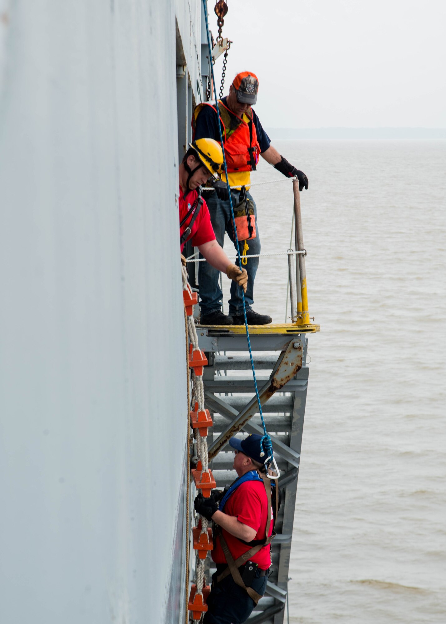 A student climbs a ladder during the 25th Annual Hampton Roads Marine Firefighting School maritime incident response exercise at Fort Eustis, Va., May 13, 2016. The exercise was the capstone event for the school, testing all the students learned about responding to a maritime fire incident. (U.S. Air Force photo by Staff Sgt. J.D. Strong II)