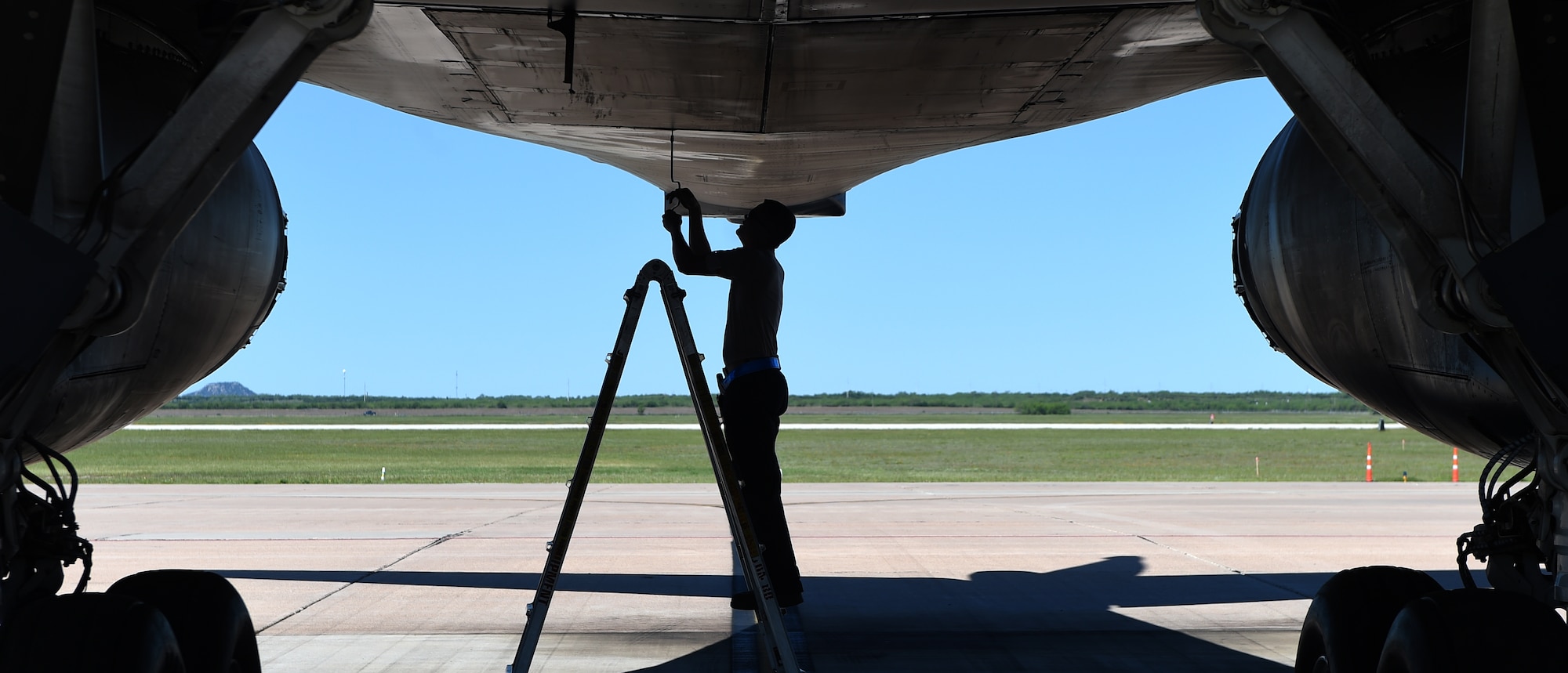 U.S. Air Force Senior Airman Jason Stach, 28th Aircraft Maintenance Unit B-1 aircraft technician, disengages the mechanical controls for the rear weapons bay doors May 3, 2016, at Dyess Air Force Base, Texas. Stach originally worked in the isochronal hangar as an inspector where they disassemble B-1s and check the components for wear and tear. He is currently responsible for basic maintenance and inspections before flights. (U.S. Air Force photo by Senior Airman Alexander Guerrero/Released)