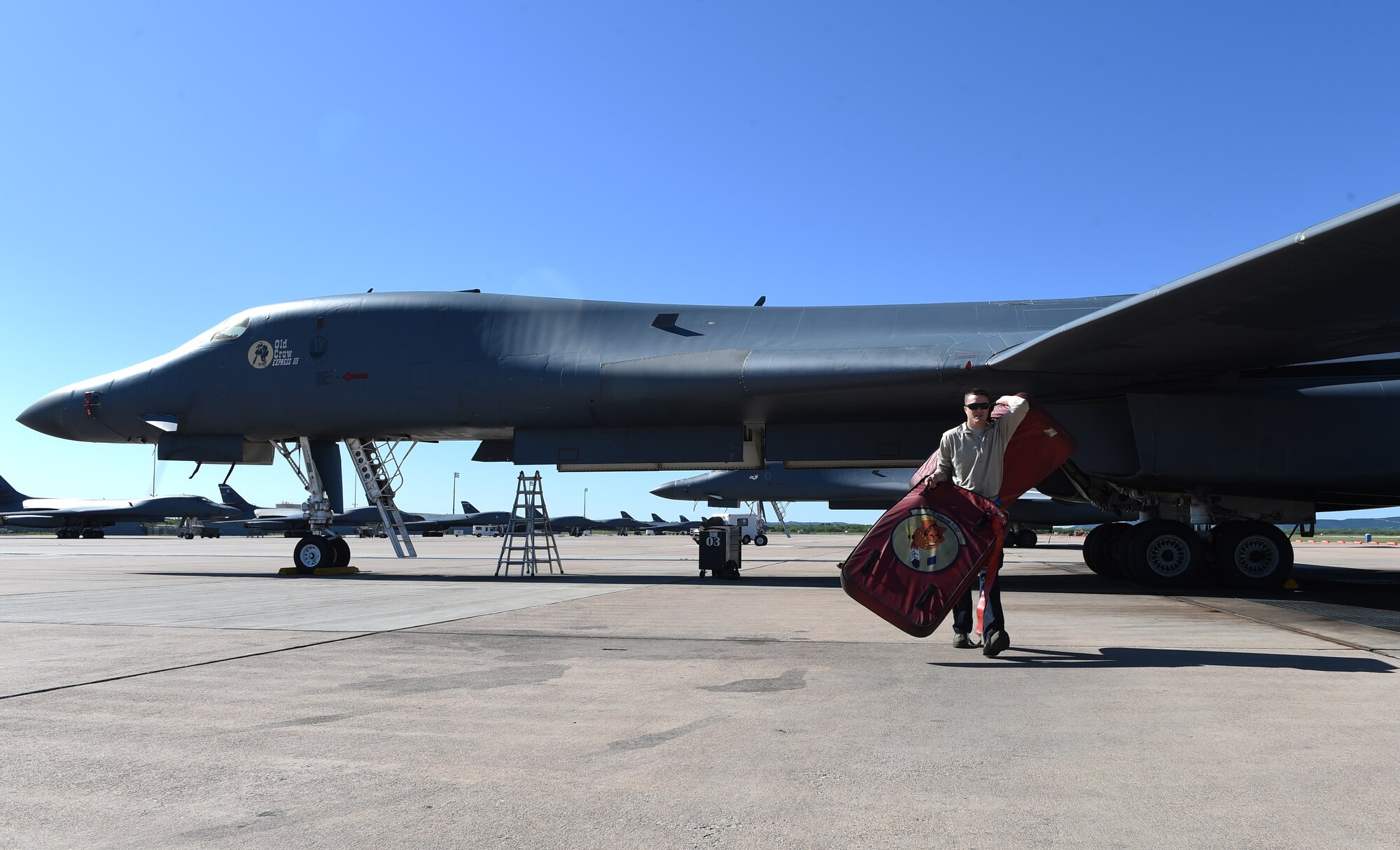 U.S. Air Force Senior Airman Jason Stach, 28th Aircraft Maintenance Unit B-1 aircraft technician, removes the inlet covers from the engines of a B-1B Lancer May 3, 2016, at Dyess Air Force Base, Texas. Stach is responsible for pre-flight inspections and maintenance on the B-1. This includes checking fluids such as fuel, oil and hydraulics, as well as landing gear and oxygen for the aircraft crew. (U.S. Air Force photo by Senior Airman Alexander Guerrero/Released)