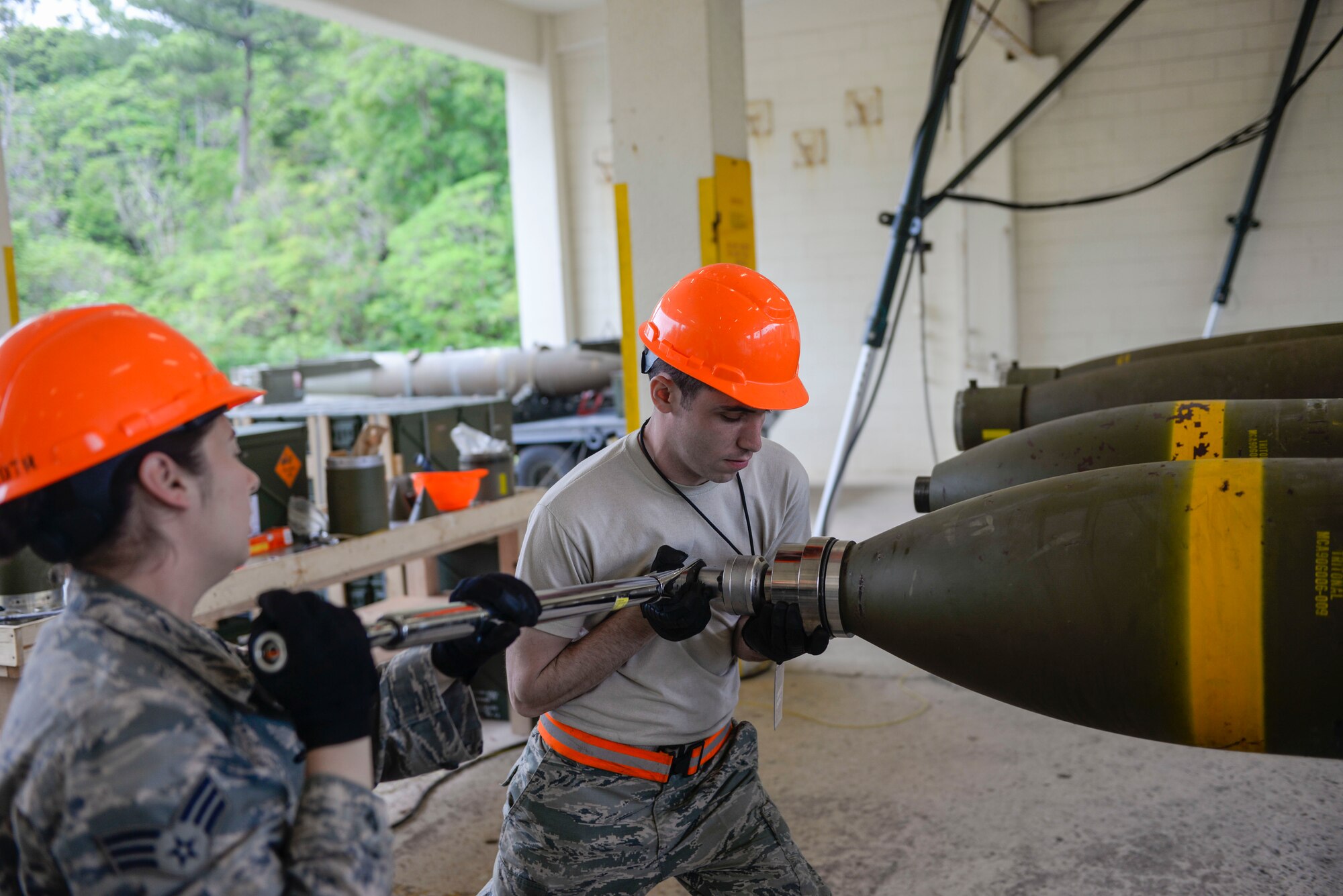 U.S. Air Force Senior Airman Talia lamanuzzi, 366th Equipment Maintenance Squadron bomb inspector, and Airman 1st Class Jacob Israel, 18th Munitions Squadron munitions crew chief, torque the head onto a “Big Bomb” during a week-long Pacific Air Forces Combat Ammunition Production Exercise May 16, 2016, at Kadena Air Base, Japan. Units from Air Combat Command and Pacific Air Forces participated in the exercise to test the munitions Airmen’s ability to build ammunition for wartime aircraft. (U.S. Air Force photo by Senior Airman Stephen G. Eigel)
