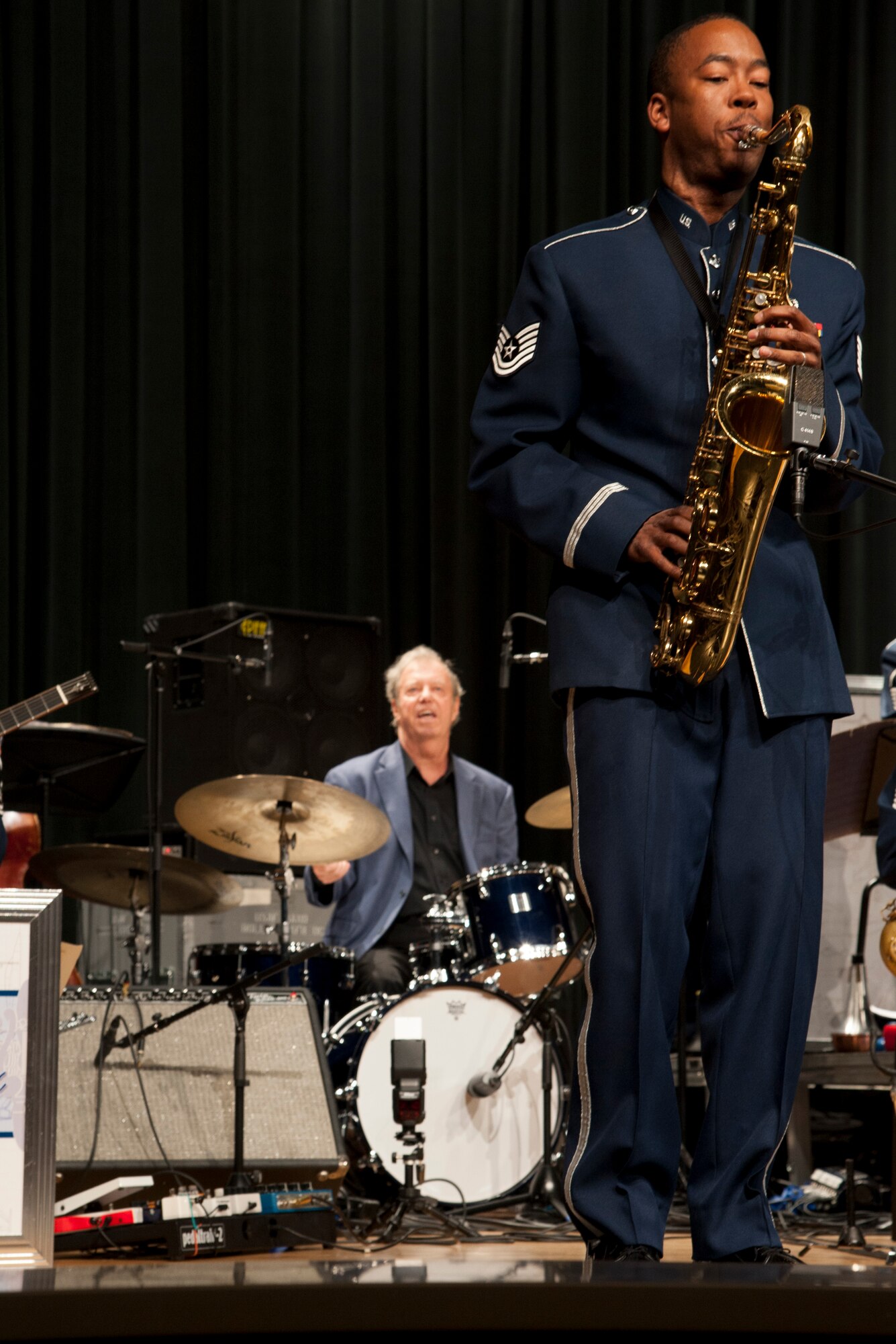 Tech. Sgt. Grant Langford, a saxophone player for the Airmen of Note, plays a solo with jazz legend Butch Miles, at a show in San Marcos, Texas, April 23. Langford and Miles were band mates in the Count Basie Orchestra before Langford joined The Note. (U.S. Air Force photo by Tech. Sgt. James Bolinger)
