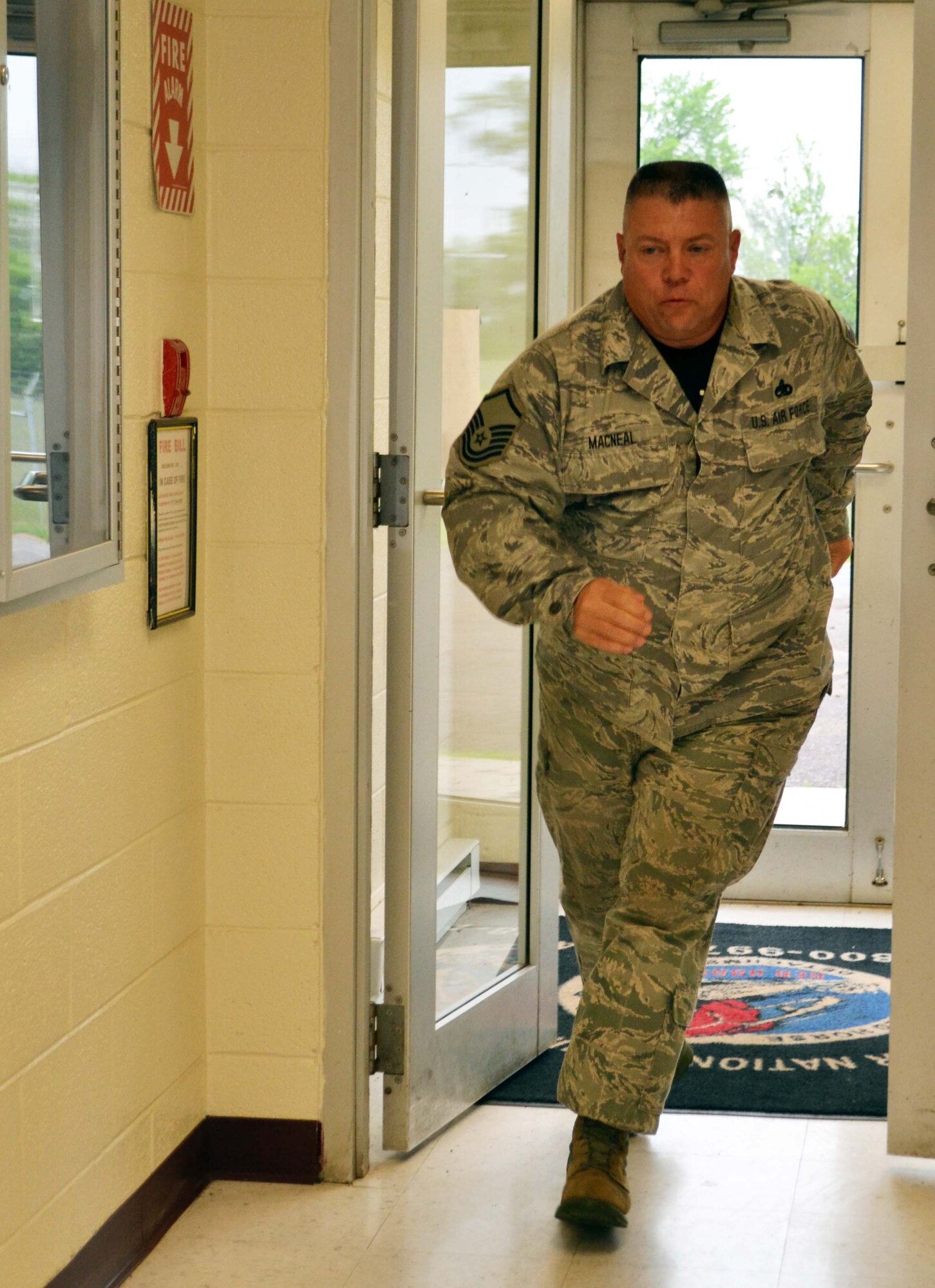 Master Sgt. Richard MacNeal, from the 201st RED HORSE Det. 1, runs to perform a lock down after hearing rifle shots during a major accident response exercise involving an active shooter and mass causalities held at Horsham Air Guard Station, Pa., April 13, 2016. For the recent MARE, planners integrated force protection measures; reaction and response; self-aid and buddy care; and interaction with outside agencies along with the active-shooter element. (U.S. Air National Guard photo by Tech. Sgt. Andria Allmond)

