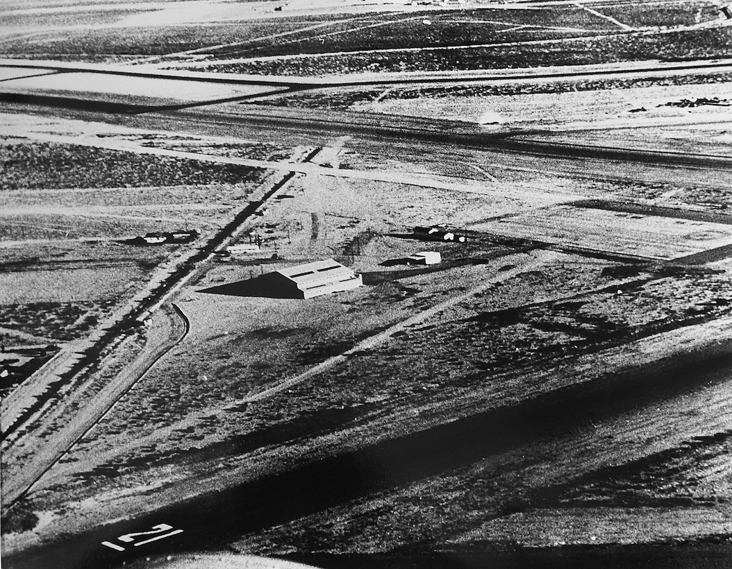 A 1956 aerial photograph showcases the humble beginnings of the 162nd Wing: the original maintenance hangar – along with a ranch house nearby serving as an office – of what was then the 152nd Interceptor Squadron. The small unit in the south Tucson desert would eventually reach wing status, evolving into the finest representation of an Air National Guard base with a global reach. (U.S. Air National Guard Photo/162nd Wing Historian’s Office/Released)