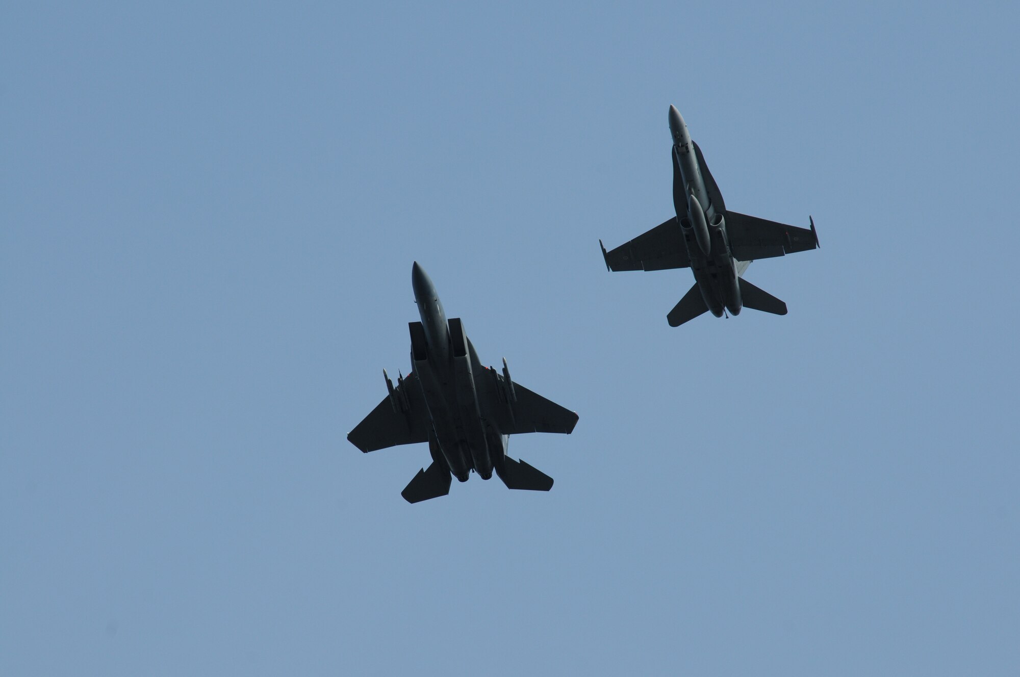 A Finnish air force F-18 and a U.S. Air Force F-15C Eagle from the 173rd Fighter Wing, Oregon Air National Guard, return to Rissala Air Base, Finland following a sortie during a training exercise that is part of Operation Atlantic Resolve, May 10, 2016. Over the course of two weeks the Oregon Air National Guard will fly jointly with the Finnish air force to practice interoperability between the two forces. (U.S. Air National Guard photo by Tech. Sgt. Jefferson Thompson/released)