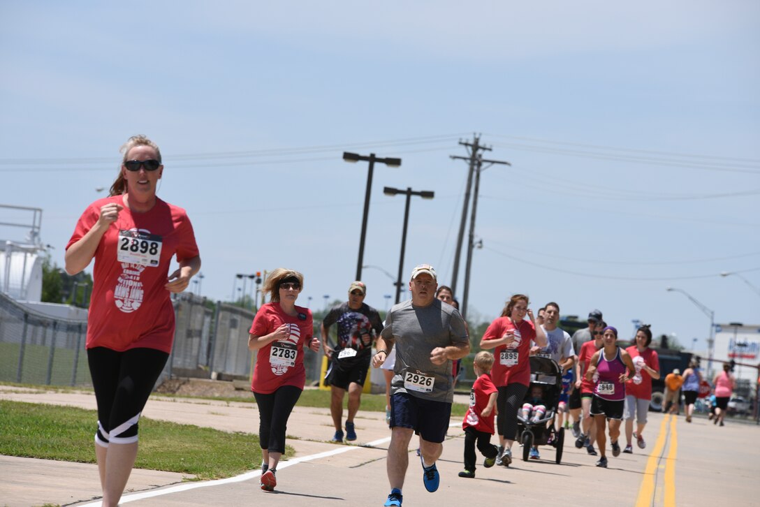 188th Wing unit members and their families celebrated Family Day May 14, 2016 at Ebbing Air National Guard Base, Ark. The day’s activities included a 5k Hawg Jawg fun run, youth fishing tournament, barbecue and live music. This annual event is designed to show appreciation to 188th Wing families for their support of the unit and its mission. (U.S. Air National Guard photo by Capt. Holli Nelson/Released)