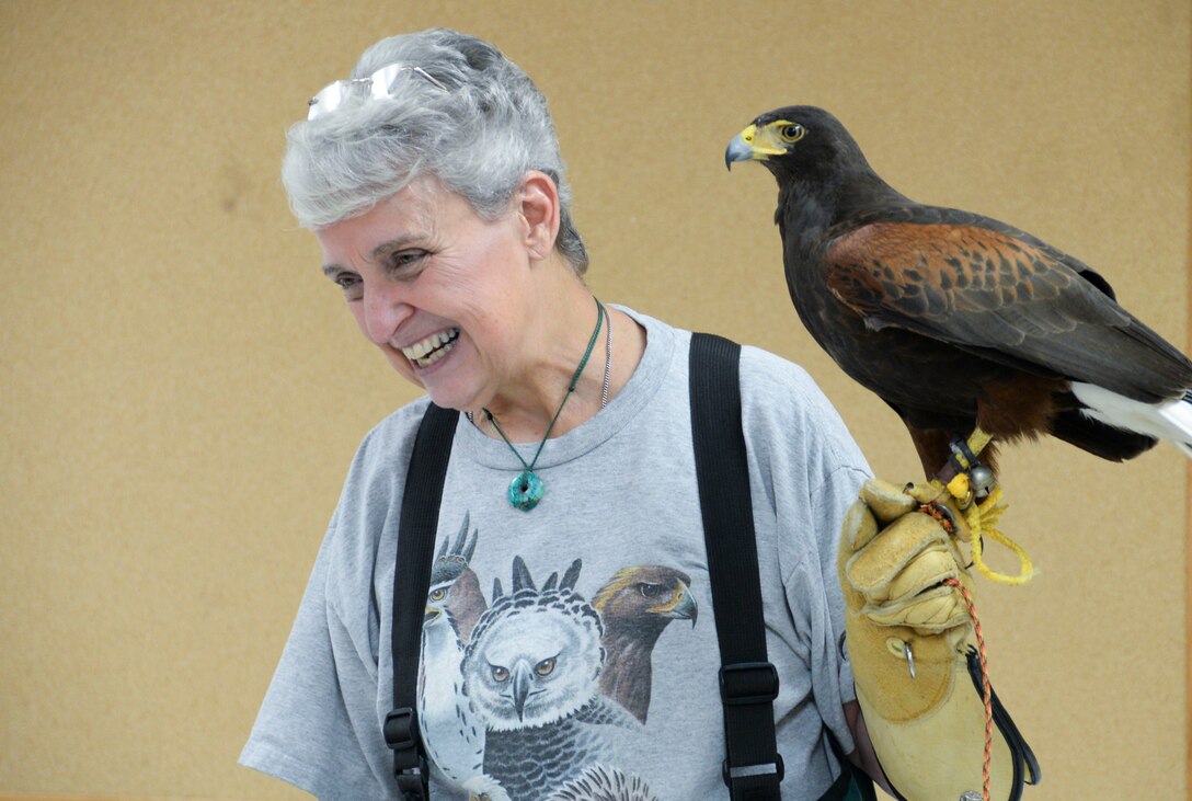 Francie Forrester, local falconer, teaches children about birds with the help of Tirzah, her Harris’s Hawk, at Barksdale Air Force Base, La., April 29, 2016. Forrester explained that all actions can affect the environment and people need to be conscious of how they treat the environment in order for it to be healthy for people and animals. (U.S. Air Force photo/Senior Airman Amanda Morris)