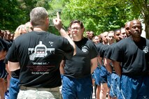 U.S. Air Force Maj. Kelly Bronson, 71st Aerial Port Squadron commander, speaks during a memorial ceremony at Langley Air Force Base, Va., May 14, 2016. More than 80 members of the 71st APS came together to honor five fallen Airmen from the air transportation career field who passed away in 2015. (U.S. Air Force photo by Staff Sgt. R. Alex Durbin)