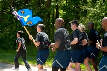 U.S. Air Force Reserves Airmen assigned to the 71st Aerial Port Squadron run in formation during a memorial ceremony at Langley Air Force Base, Va., May 14, 2016. This year, the squadron honored five air transportation Airmen, including Tech. Sgt. Isaac Gervasio who served in the 71st APS before his death in November 2015. (U.S. Air Force photo by Staff Sgt. R. Alex Durbin)
