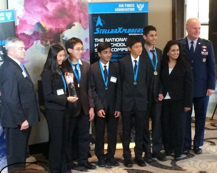 Maj. Gen. Roger Teague, director of space programs, Office of the Assistant Secretary of the Air Force for acquisition, presents an award to Sirius Potatoes from Palos Verdes Peninsula High School in Rolling Hills Estates, Calif., April 14, 2016, in Colorado Springs, Colo. (U.S. Air Force photo/Kevin Gooder)