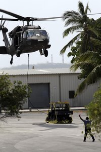 RBDF member helping in sling-load exercises in support of target development for Exercise MARLIN SHIELD. 
