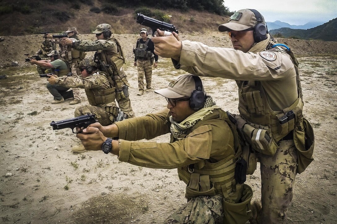 Navy Petty Officer 1st Class Carlos Gomez and Canadian Army Cpl. Brett White-Finkle practice two-man firearm tactics during the 2016 Summer Quick Shot exercise in Azusa, Calif., May 17, 2016. Navy photo by Petty Officer 2nd Class Torrey W. Lee