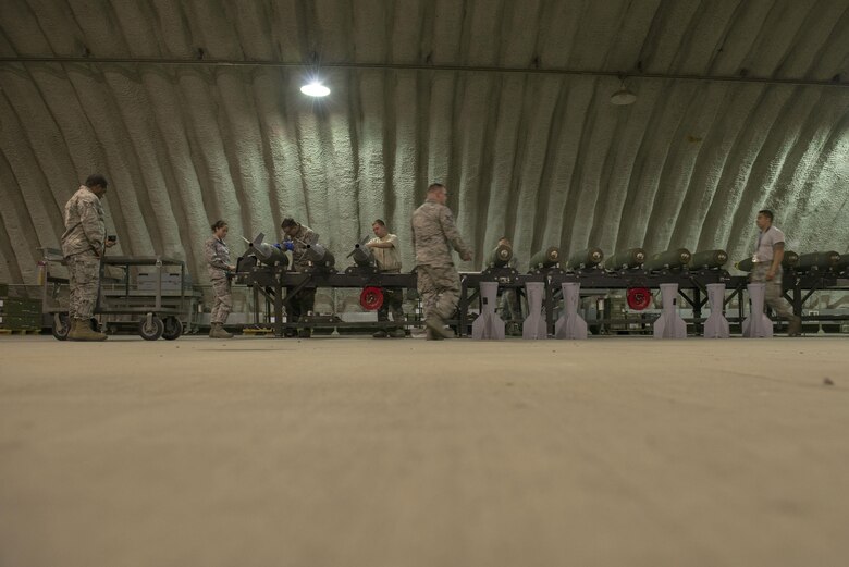 U.S. Air Force maintainers from the 354th Maintenance Squadron and the 8th Maintenance Squadron, assigned to Kunsan Air Base, Republic of South Korea, assemble Mark 82 bombs during RED FLAG-Alaska 16-1, May 9, 2016, on Eielson Air Force Base, Alaska. Kunsan brought 10 Aircraft Munitions Maintenance Organization Airmen and will participate through Northern Edge exercise operations. (U.S. Air Force photo by Staff Sgt. Ashley Nicole Taylor/Released)

