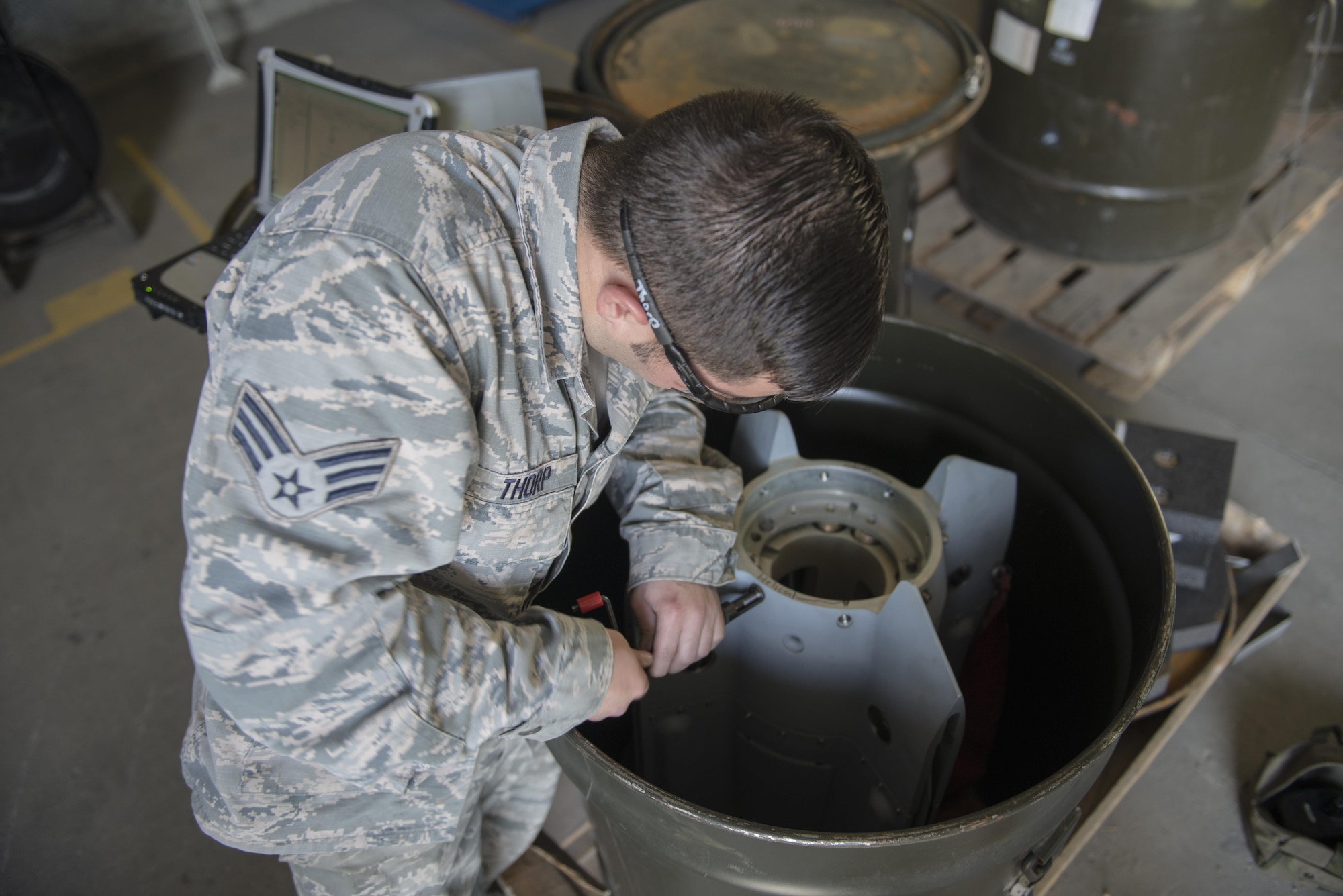U.S. Air Force Senior Airman Scott Thorp, a 354th Maintenance Squadron metals technician, replaces threads on a Mark 82 bomb, May 10, 2016, on Eielson Air Force Base, Alaska. The Aircraft Munitions Maintenance Organization shop handles each MK 82 from start to finish. (U.S. Air Force photo by Staff Sgt. Ashley Nicole Taylor/Released)
