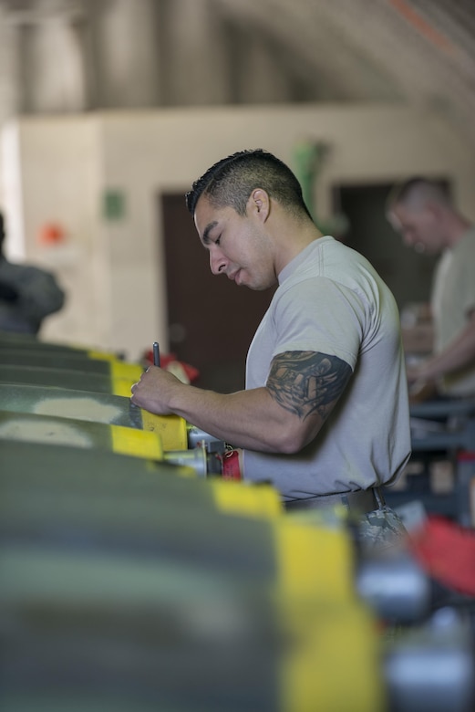 U.S. Air Force Tech. Sgt. Joe Cedillo, the 8th Maintenance Squadron assistant NCO in charge of conventional maintenance, assigned to Kunsan Air Base, Republic of South Korea, labels the settings of a Mark 82 bomb during RED FLAG-Alaska 16-1, May 10, 2016, on Eielson Air Force Base, Alaska. Prior to leaving the warehouse, Cedillo inspects each of the MK 82 bombs prior to them leaving the warehouse to ensure they are labeled accurately. (U.S. Air Force photo by Staff Sgt. Ashley Nicole Taylor/Released)
