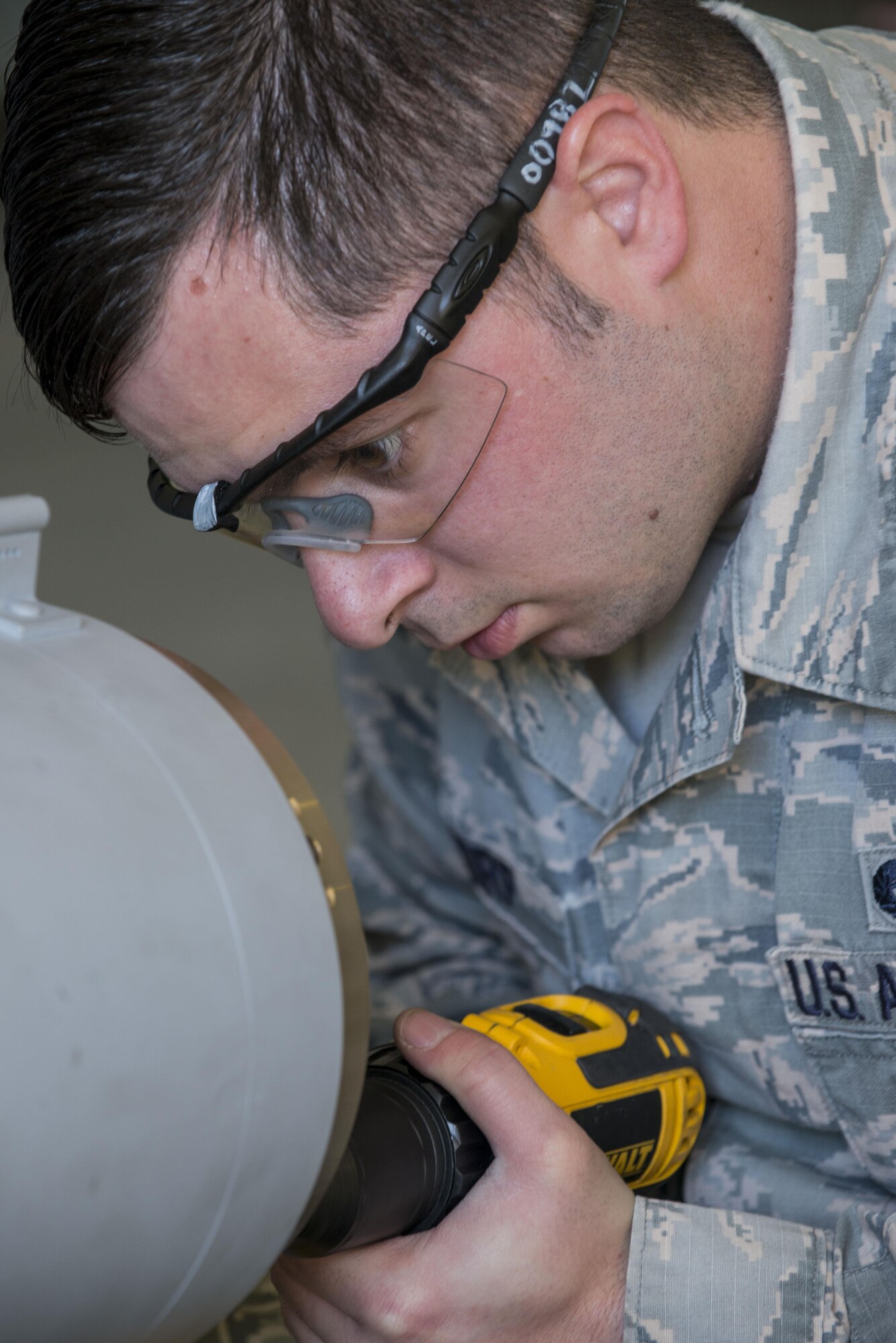 U.S. Air Force Senior Airman Scott Thorp, a 354th Maintenance Squadron metals technician, cuts holes for threading on a Mark 82 bomb, May 10, 2016, on Eielson Air Force Base, Alaska. During RED FLAG-Alaska 16-1, Aircraft Munitions Maintenance Organization specialists assembled multiple bombs to be dropped for training operations in the Joint Pacific Alaska Range Complex. (U.S. Air Force photo by Staff Sgt. Ashley Nicole Taylor/Released)