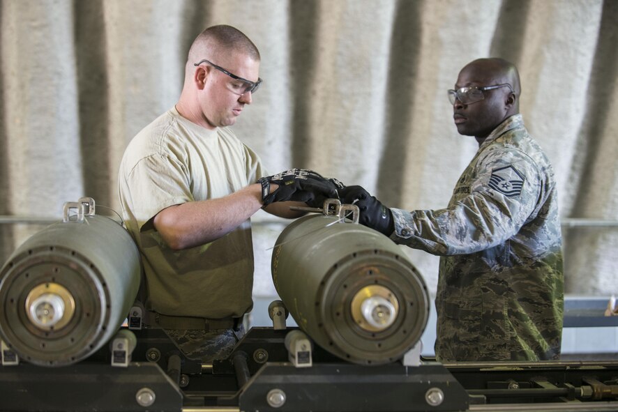 U.S. Air Force Staff Sgt. Thomas Johnson, left, and Master Sgt. Anthonio Dais, members of the 8th Maintenance Squadron, assigned to Kunsan Air Base, Republic of South Korea, assemble a Mark 82 bomb during RED FLAG-Alaska (RF-A) 16-1, May 10, 2016, on Eielson Air Force Base, Alaska. Aircraft Munitions Maintenance Organization Airmen from both Kunsan and Eielson built munitions for exercises RF-A and Northern Edge. (U.S. Air Force photo by Staff Sgt. Ashley Nicole Taylor/Released)
