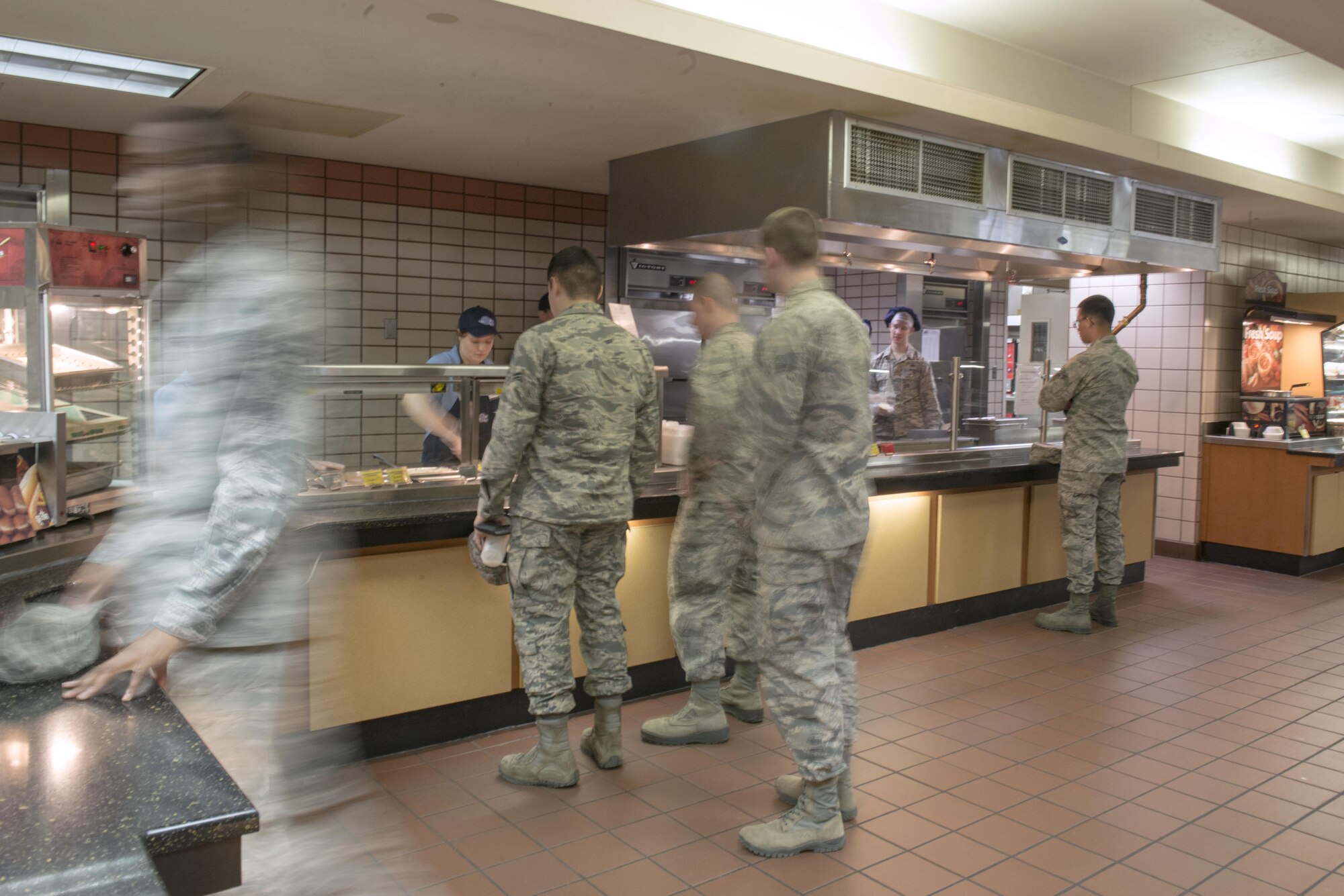 Members participating in RED FLAG-Alaska (RF-A) 16-1 eat during the lunch rush, May 11, 2016, in the Two Seasons Dining Facility, Eielson Air Force Base, Alaska. The dining facility anticipates feeding up to 1,200 people daily for the upcoming RF-A 16-2. (U.S. Air Force photo by Staff Sgt. Ashley Nicole Taylor/Released)