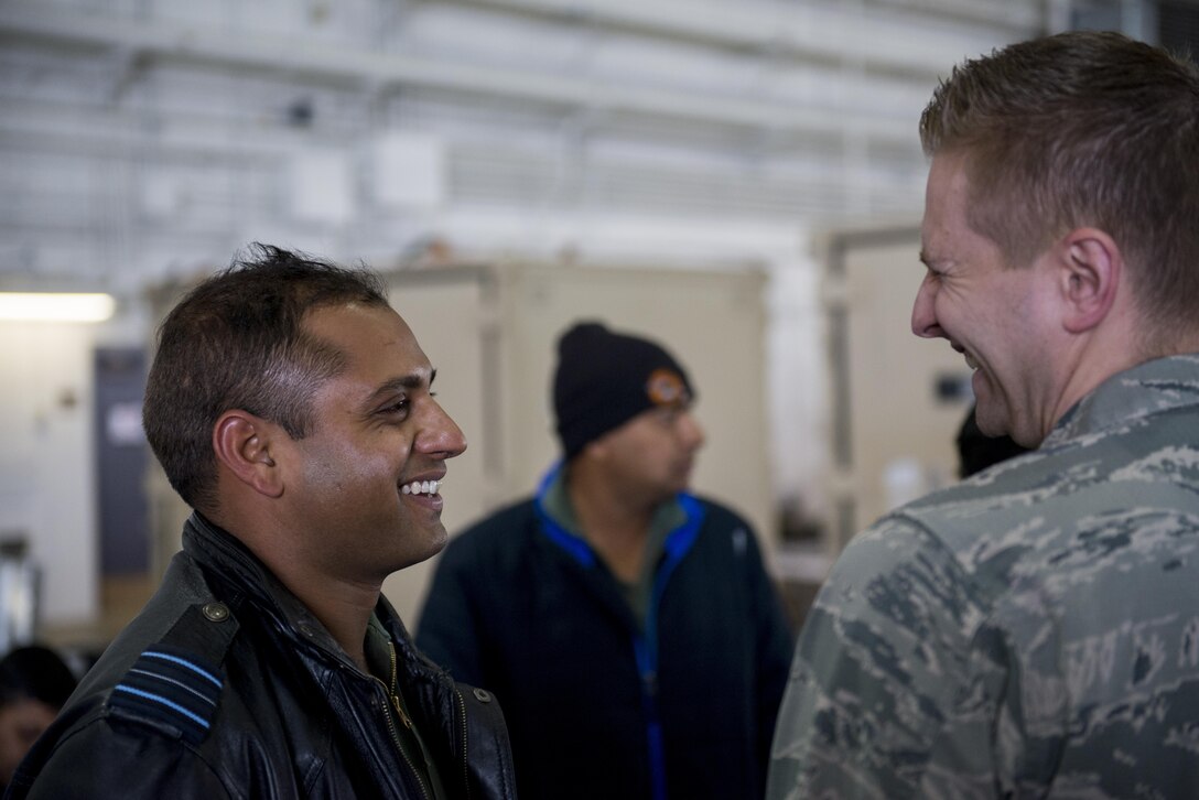U.S. Air Force Chaplain (Capt) Philip Vincent, a 354th Fighter Wing chaplain, shares a laugh with a member of the Indian Air Force (IAF), May 9, 2016, on Eielson Air Force Base, Alaska. The IAF participated in RED FLAG-Alaska for the first time to trade best practices and strengthen the relationship between U.S. forces and the IAF. (U.S. Air Force Photo by 1Lt Elias Zani/Released)