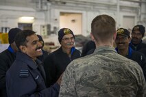 U.S. Air Force Chaplain (Capt) Philip Vincent, foreground, a 354th Fighter Wing chaplain, converses with Indian Air Force Airmen, May 9, 2016, on Eielson Air Force Base, Alaska. During RED FLAG-Alaska exercises, chaplains assigned to the 354th Fighter Wing spoke with various units to boost morale and strengthen relationships with visitors. (U.S. Air Force Photo by 1Lt Elias Zani/Released)