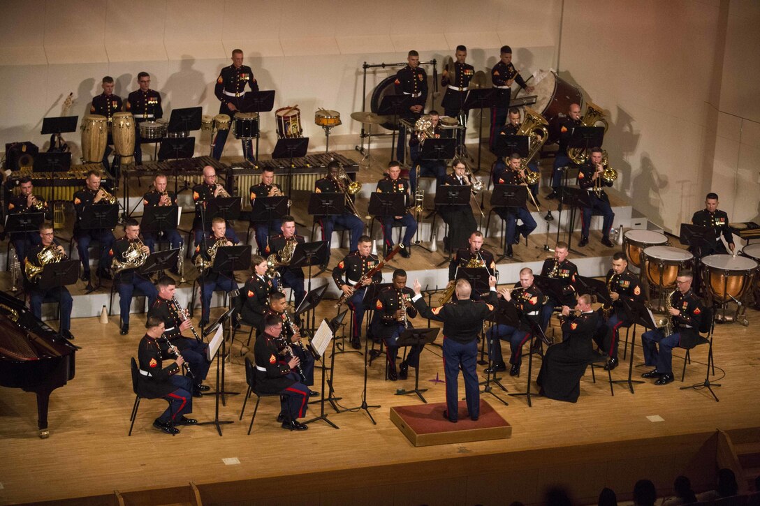 CAMP HANSEN, Okinawa, Japan – The III Marine Expeditionary Force Band performed their Spring Concert for the Okinawan community and distinguished guests May 7, 2016 at Tedako Hall, Okinawa, Japan. III MEF Commander Lt. Gen. Lawrence Nicholson, Ginowan City Mayor Atsushi Sakima, Ministry of Foreign Affairs Ambassador Masashi Mizukami and many other distinguished visitors attended the concert. The III MEF Band is the only expeditionary force band in the Marine Corps, exhibiting diverse musical capabilities and proficiency in a wide variety of settings. (U.S. Marine Corps photo by Cpl. Tiffany Edwards)