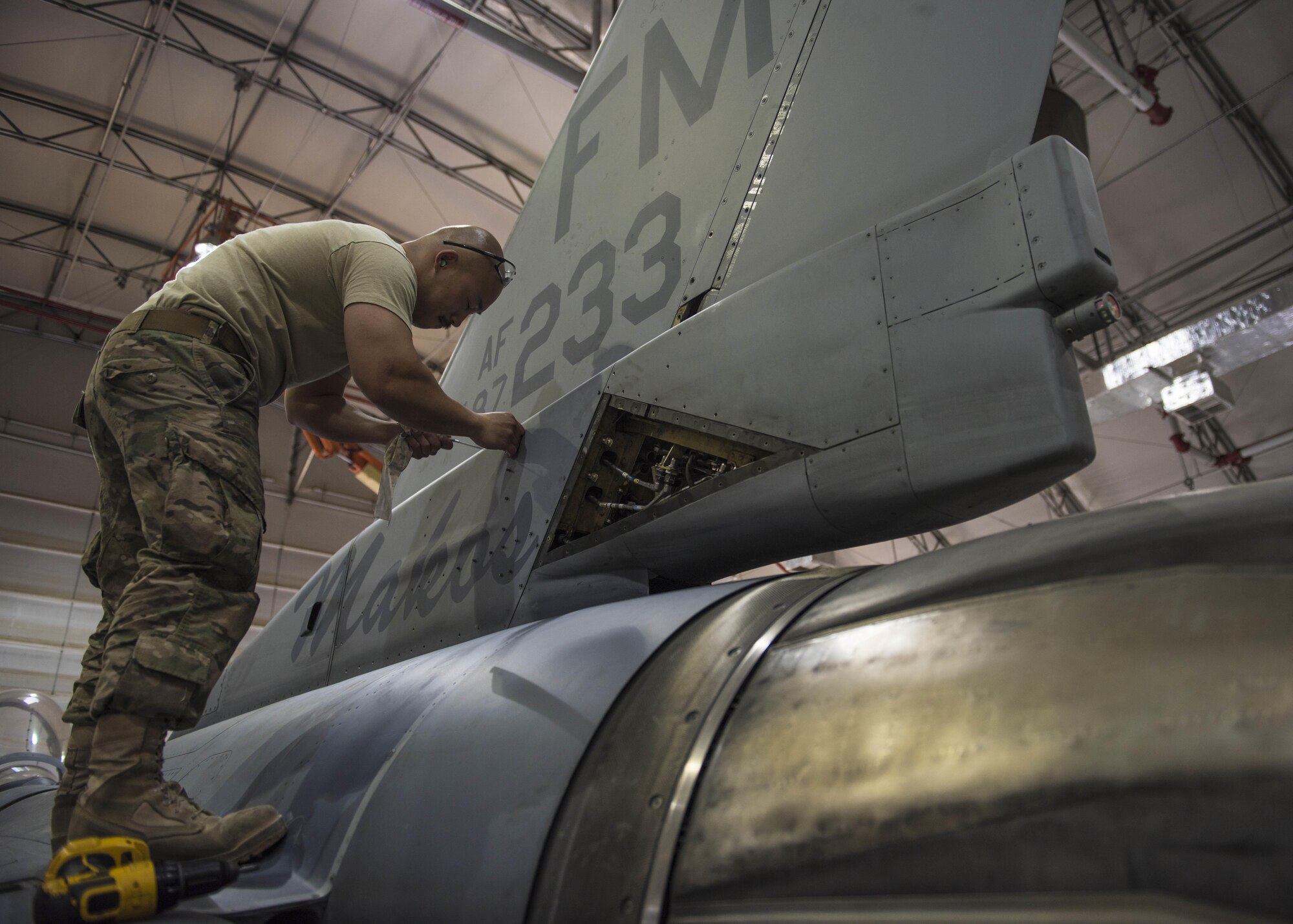 Technical Sgt. Rene Garcia, 455th Expeditionary Aircraft Maintenance Squadron phase technician, puts a panel back on an F-16C Fighting Falcon during routine phase maintenance at Bagram Airfield, Afghanistan, May 18, 2016. Phase Airmen are assigned specific sections of the aircraft to ensure it is thoroughly inspected. (U.S. Air Force photo by Senior Airman Justyn M. Freeman)
