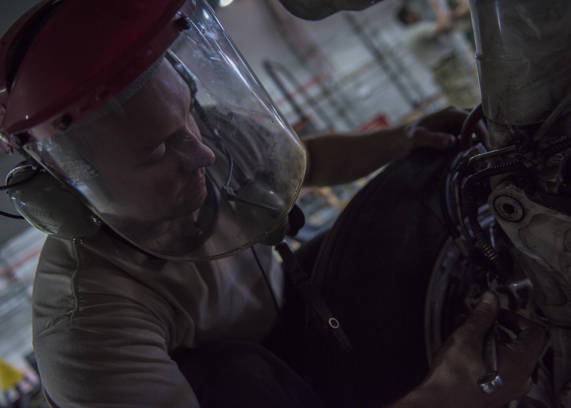Senior Airman Jonathan Clark, 455th Expeditionary Aircraft Maintenance Squadron phase technician, clears the brake lines of fluid on an F-16C Fighting Falcon during routine phase maintenance at Bagram Airfield, Afghanistan, May 18, 2016. Members of the 455th Expeditionary Aircraft Maintenance Squadron ensure that aircraft at Bagram are prepared for flight and return them to a mission-ready state once they land. (U.S. Air Force photo by Senior Airman Justyn M. Freeman)