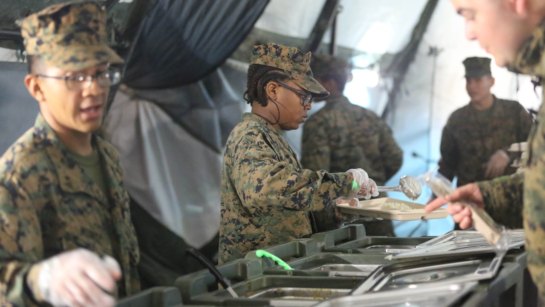 Food service specialists serve chow to more than 300 Marines, during Marine Expeditionary Force Exercise 2016, at Marine Corps Air Station Cherry Point, N.C., May 13, 2016. MEFEX 16 is designed to synchronize and bring to bear the full spectrum of II MEF’s command and control capabilities in support of a Marine Air-Ground Task Force. 