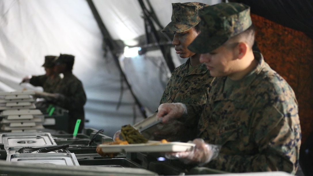 Food service specialists serve chow to more than 300 Marines, during Marine Expeditionary Force Exercise 2016, at Marine Corps Air Station Cherry Point, N.C., May 13, 2016. MEFEX 16 is designed to synchronize and bring to bear the full spectrum of II MEF’s command and control capabilities in support of a Marine Air-Ground Task Force. 