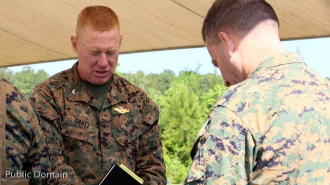 Col. Russel Graef prays with his fellow service members while providing religious services at II Marine Expeditionary Force Exercise 2016 at Marine Corps Air Station Cherry Point, N.C., May 15, 2016. Much support was provided for the Marines over the two-week-long training exercise, including the mess tent, showers, laundry, and religious services. Support came from many 2nd Marine Aircraft Wing units, including Marine Wing Headquarters Squadron 2, Marine Air Control Group 28, and Marine Wing Support Squadron 271. Graef is the 2nd Marine Aircraft Wing chaplain. 