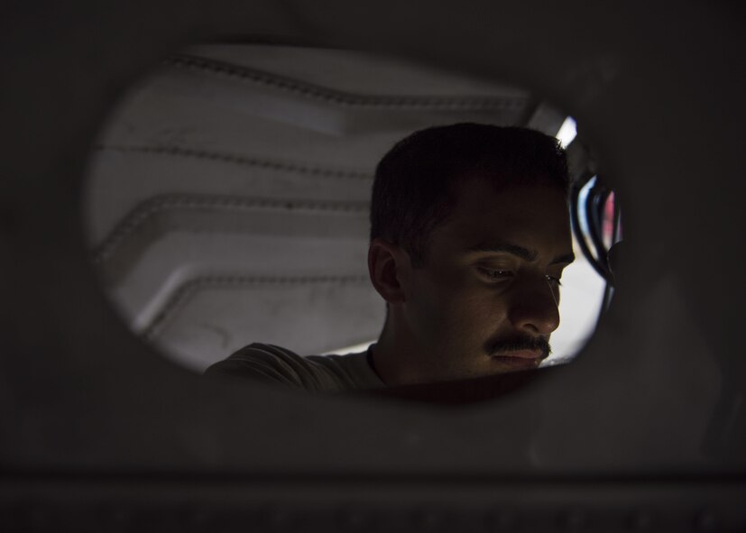 Staff Sgt. Noel Feliciano, 455th Expeditionary Aircraft Maintenance Squadron phase technician, inspects the interior on an F-16C Fighting Falcon during routine phase maintenance at Bagram Airfield, Afghanistan, May 18, 2016. This aircraft is going through phase maintenance where members of the 455th EAMS phase flight closely inspect the aircraft for cracks and other types of damage, verifying that the 30 plus year old aircraft is safe to fly. (U.S. Air Force photo by Senior Airman Justyn M. Freeman)