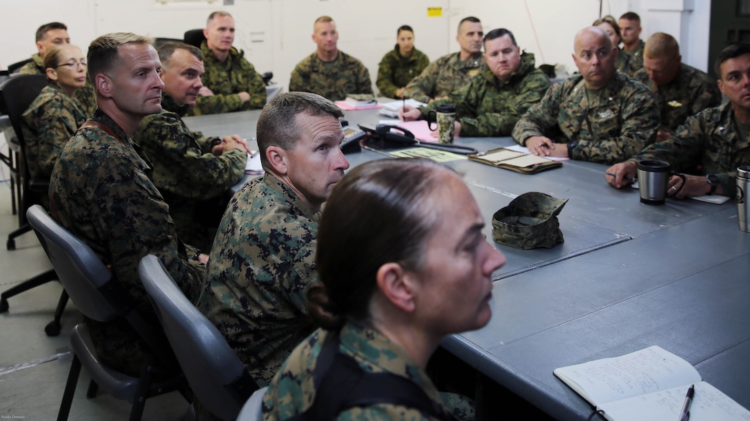 The 2nd Marine Aircraft Wing Commanding General, Maj. Gen. Gary L. Thomas and his battle staff gather for a II Marine Expeditionary Force commanders update brief during MEFEX 16 at Marine Corps Air Station Cherry Point, N.C., May 15, 2016. MEFEX 16 is a command and control exercise conducted in a deployed environment designed to synchronize and bring to bear the full spectrum of II MEF’s C2 capabilities in support of a Marine Air-Ground Task Force. Conducting exercises of this nature ensures II MEF remains ready to  provide combatant commanders with an experienced staff capable of integrating with international allied and partner nations in a combined joint task force, charged with accomplishing a wide range of military operations. 