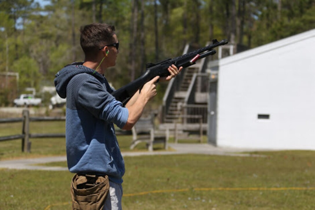 Cpl. Brandon Thomas clears a shotgun during a trap and skeet range at Marine Corps Air Station Cherry Point, N.C., April 14, 2016. Twenty Marines with 2nd Low Altitude Air Defense Battalion’s Firearms Mentorship Program utilized their marksmanship skills during the range as part of their firearms safety classes. The mentorship program promotes safe private gun ownership, builds confidence in marksmanship skills and increases Marines combat readiness by familiarizing them with other weapons. Thomas is a radio technician with the battalion. (U.S. Marine Corps photo by Cpl. N.W. Huertas/ Released)