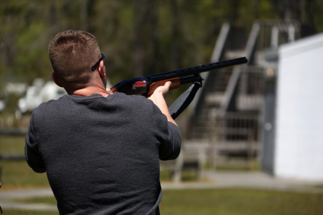 Pfc. Jesse Conti fires a shotgun during a trap and skeet range at Marine Corps Air Station Cherry Point, N.C., April 14, 2016. Twenty Marines with 2nd Low Altitude Air Defense Battalion’s Firearms Mentorship Program utilized their marksmanship skills during the range as part of their firearms safety classes. The mentorship program promotes safe private gun ownership, builds confidence in marksmanship skills and increases Marines combat readiness by familiarizing them with other weapons. Conti is a low altitude air defense gunner with the battalion. (U.S. Marine Corps photo by Cpl. N.W. Huertas/ Released)